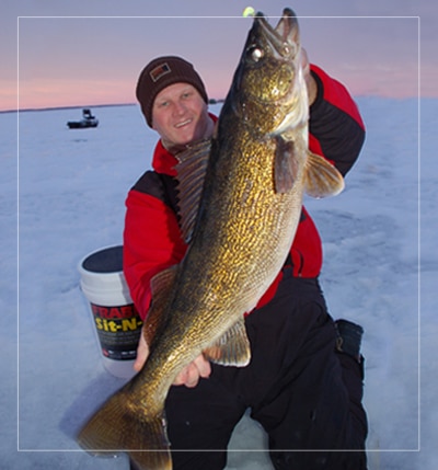 ice fishing guide bret alexander with huge walleye