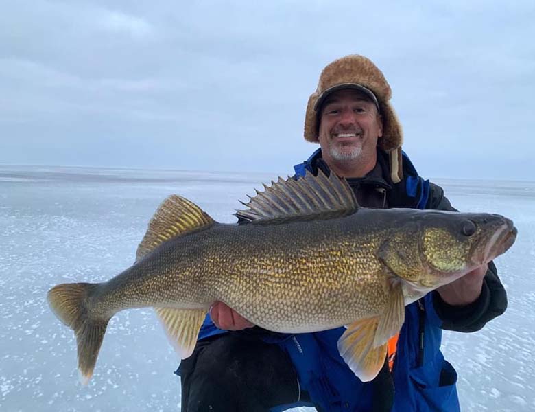 Ice Fishing Sturgeon Bay Man Holding Walleye